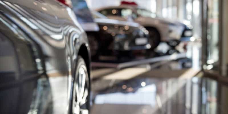 New cars at dealer showroom.